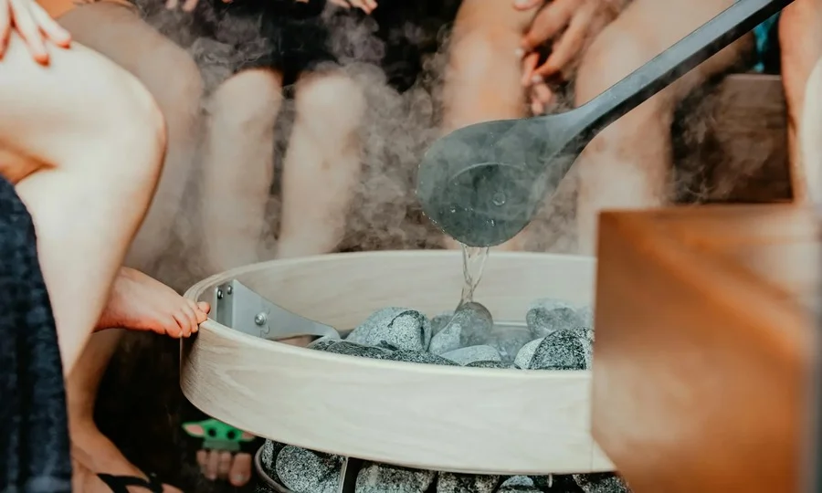 People relaxing in a sauna