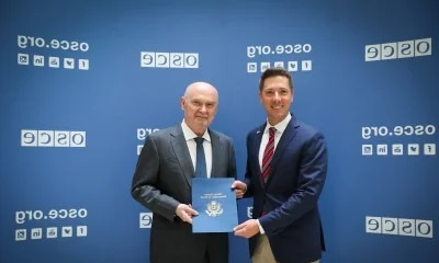 Diplomats negotiating at OSCE meeting